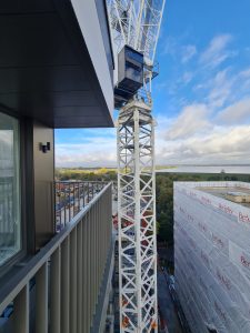Incredible Success: 216 Prefabricated Balconies for Residential Schemes 2 Tower crane used for the SlideOn installation of prefabricated balconies for residential schemes construction site.